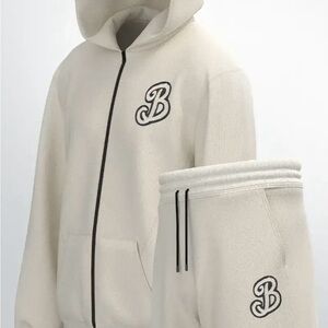 Cream Hoodie and Sweatpants Set with cream and black embroidered logo.
